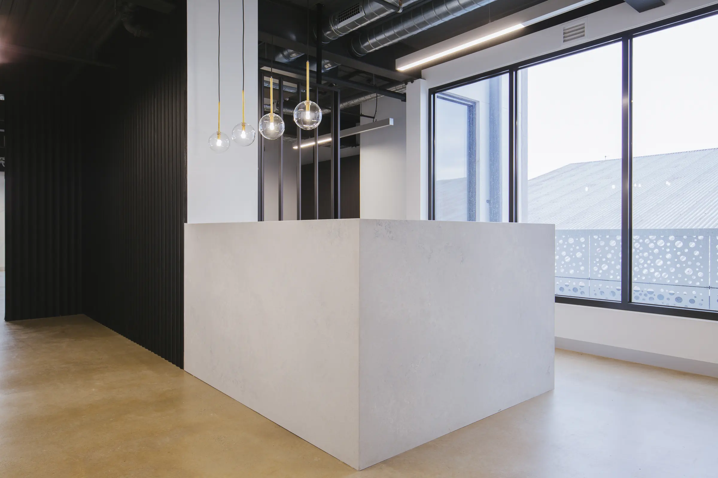 Stone-clad reception block beside the windows